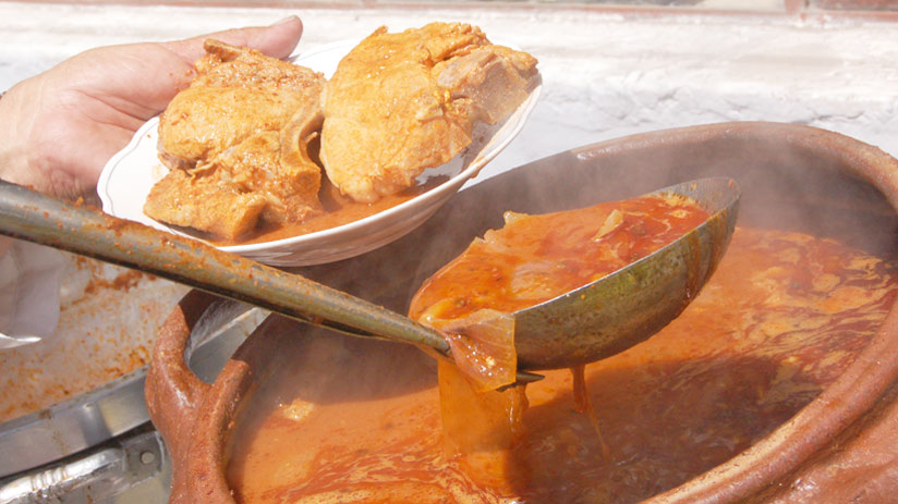 tours in cusco enjoying adobo food